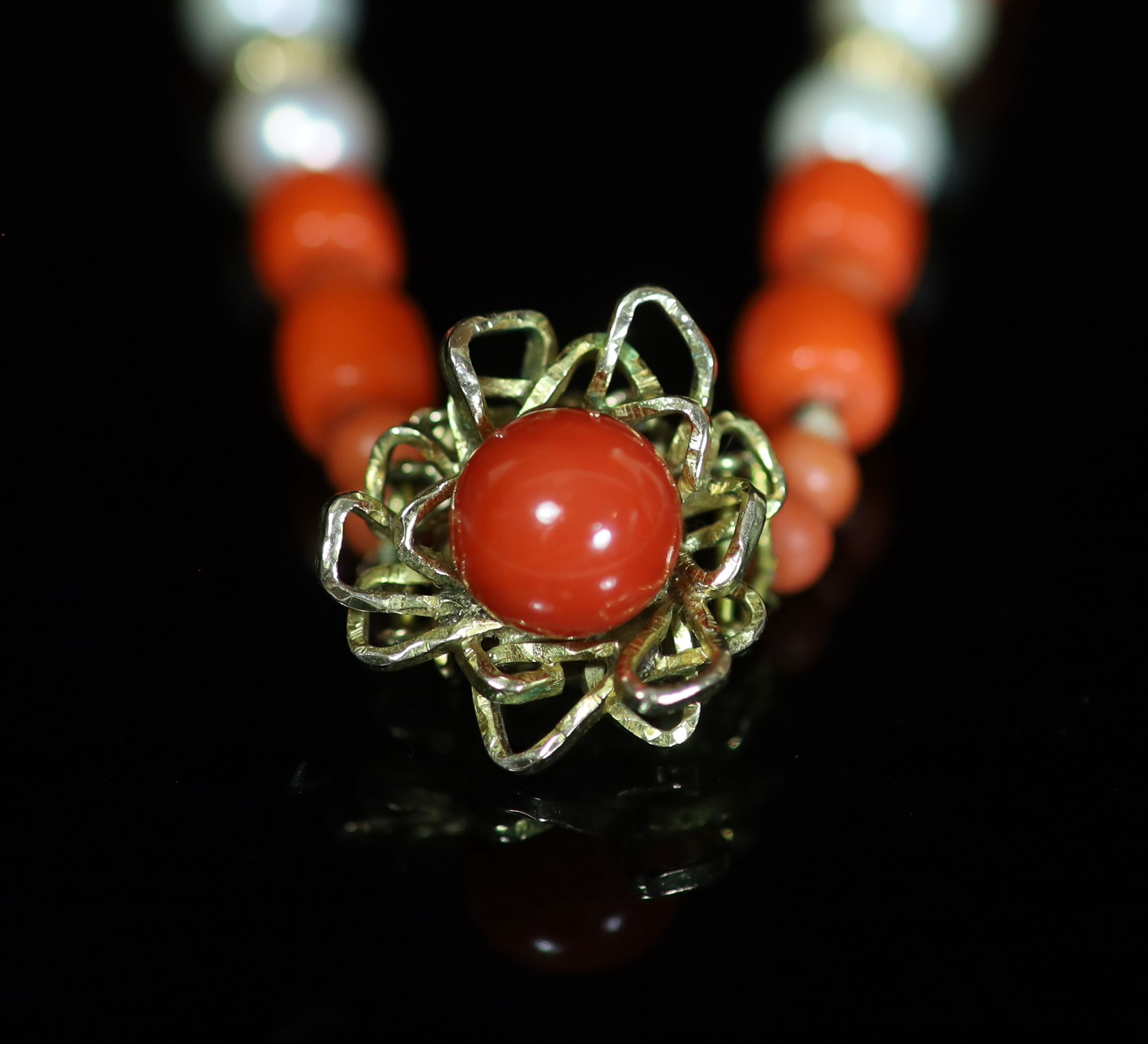 A coral bead and cultured pearl necklace with 14K yellow gold clasp,
